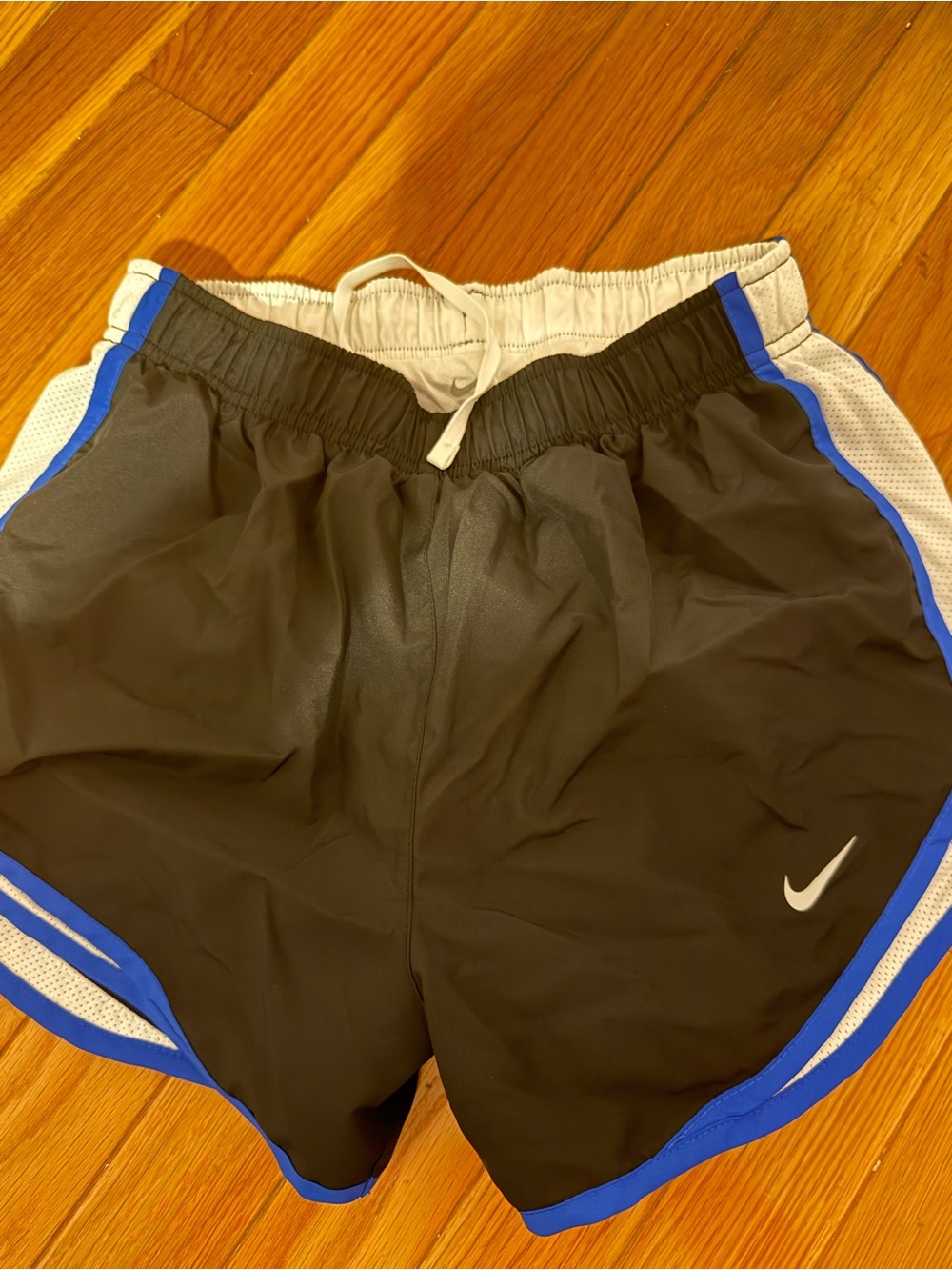 Nike women’s Black Athletic Shorts with Blue and White Accents